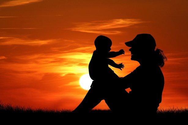 Mother And Baby At Sunset