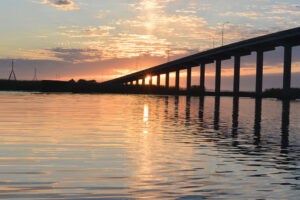 River Sunrise With Bridge And Clouds