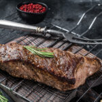 Bbq Grilled Tri Tip Beef Steak On A Grill. Black Background. Top View