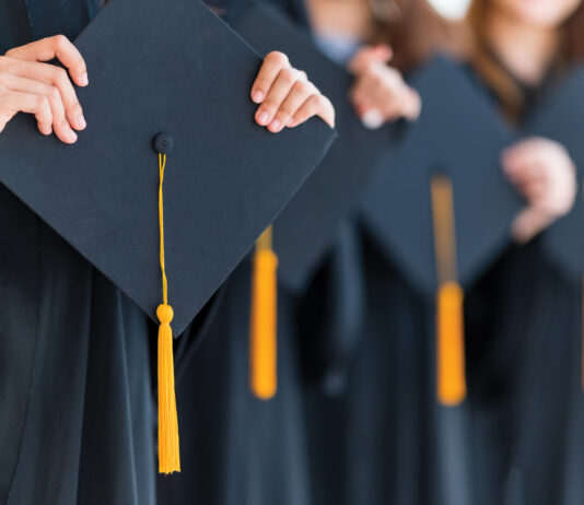 Close Up Group Of Graduates Holding A Hat At The Graduation Ceremony At The University