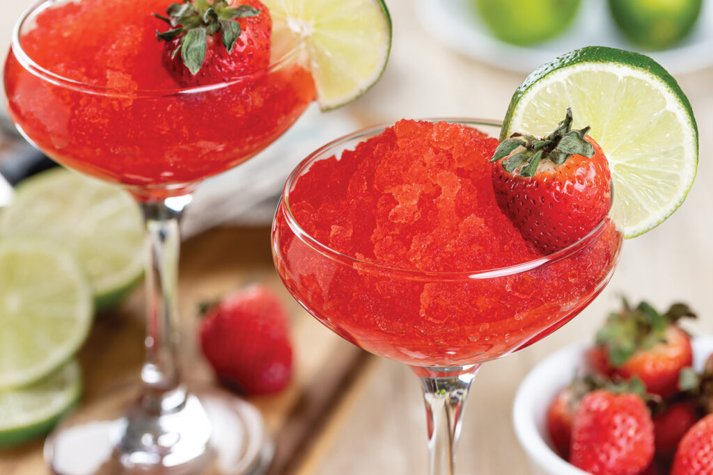 Frozen Strawberry Daiquiri Cocktail With Strawberries And Lime