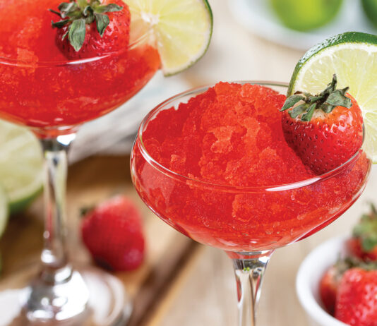 Frozen Strawberry Daiquiri Cocktail With Strawberries And Lime