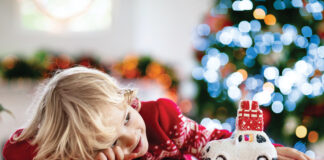 Child With Christmas Present. Kid With Xmas Gift.