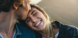 Romantic Boyfriend Kissing On Happy Girlfriend's Forehead