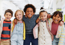 Science, Portrait And Group Of Children With Happiness At Convention, Expo Or Exhibition For Workshop. Student, Kid Or Face With Smile At Tradeshow Or Scientific Conference For Knowledge Or Education