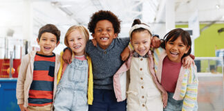 Science, Portrait And Group Of Children With Happiness At Convention, Expo Or Exhibition For Workshop. Student, Kid Or Face With Smile At Tradeshow Or Scientific Conference For Knowledge Or Education