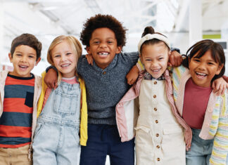 Science, Portrait And Group Of Children With Happiness At Convention, Expo Or Exhibition For Workshop. Student, Kid Or Face With Smile At Tradeshow Or Scientific Conference For Knowledge Or Education